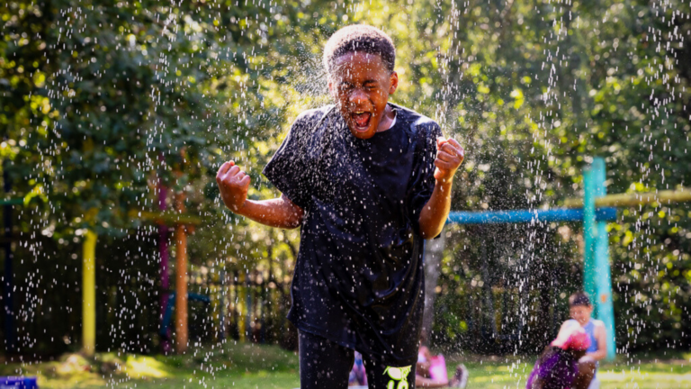 young boy having fun in water